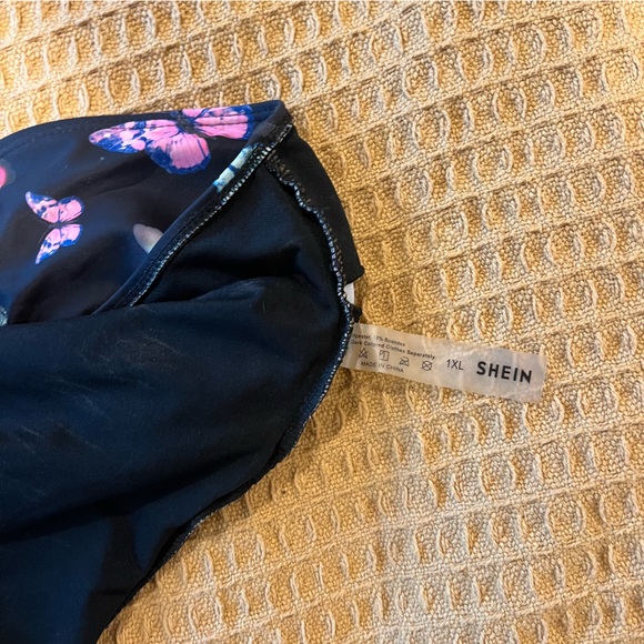 1 black,1 butterfly design one piece and 1 high waisted bottom - Picture 6 of 10